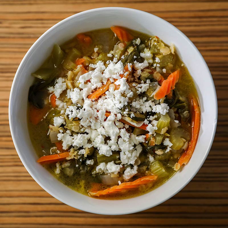 Bowl of freshly homemade vegetable soup with feta cheese by Vancouver based Holistic Nutritionist Judy Chambers